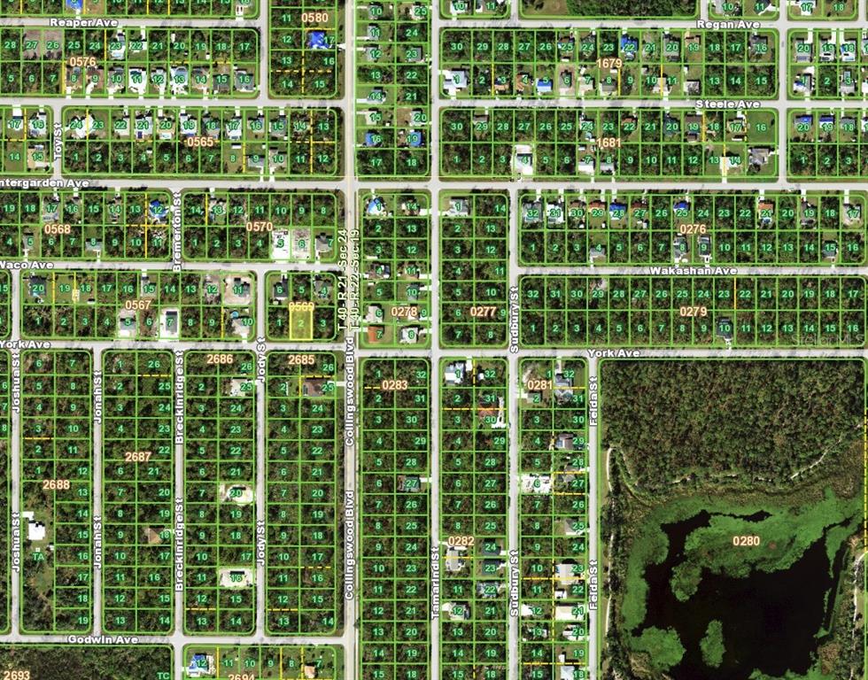 This is an aerial map showing residential lots, streets, and a lake in a neighborhood — 17516 YORK AVENUE, PORT CHARLOTTE, FL