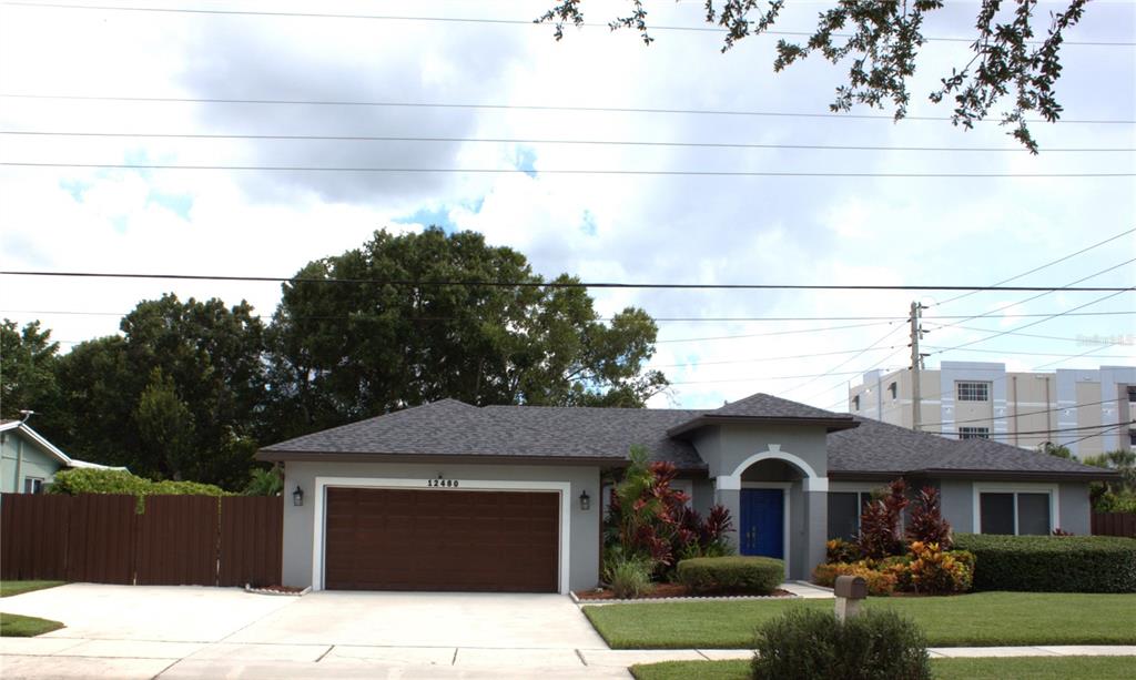 A single-story house with a gray exterior, a brown garage door, and a blue front door — 12480 SW 2ND STREET, PLANTATION, FL