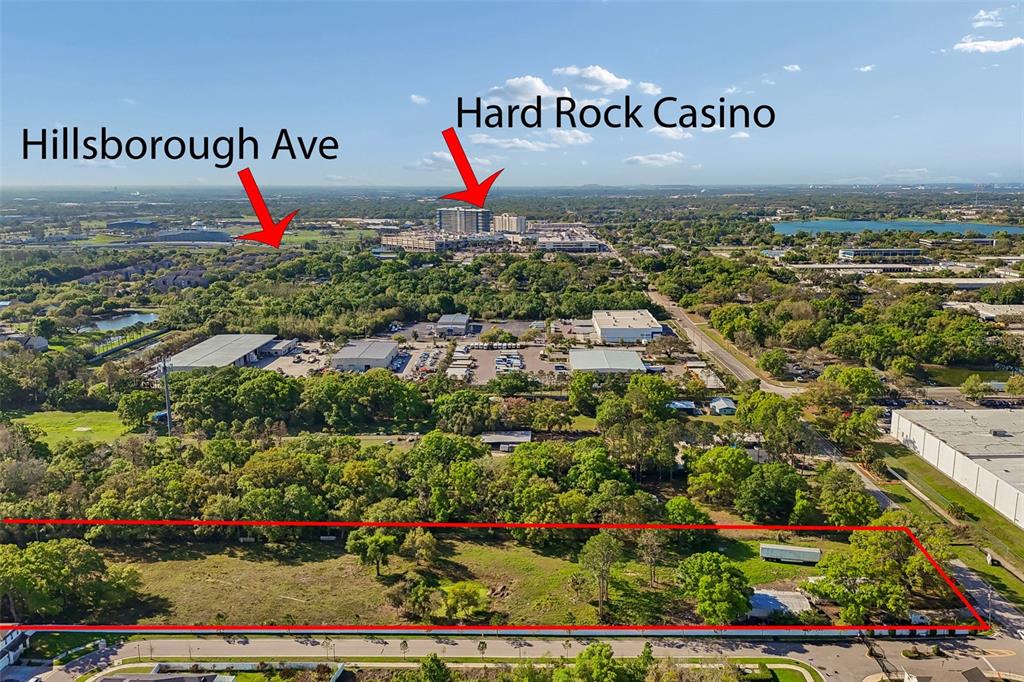 This aerial view shows a vacant, rectangular plot of land near the Hard Rock Casino — 6213 ORIENT ROAD, TAMPA, FL