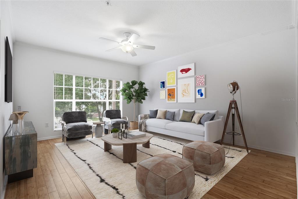 A living room features a white sofa, two armchairs, a coffee table, and a gallery wall — 809 S OREGON AVENUE UNIT B, TAMPA, FL