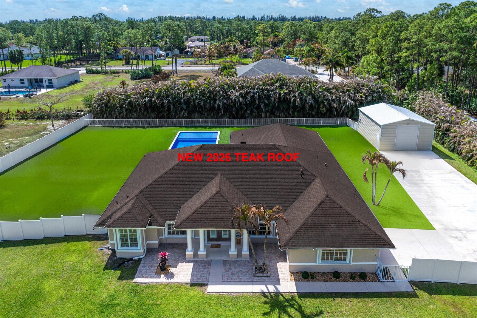A sample board displays Owens Corning Duration shingles in the color Teak — 15436 66th Court N, Loxahatchee FL 33470, LOXAHATCHEE, FL