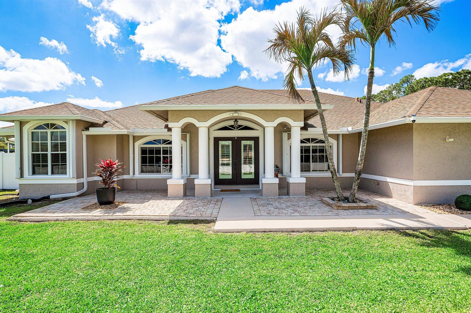 A red graphic contains white text offering seller contributions toward closing costs or rate buy-downs — 15436 66th Court N, Loxahatchee FL 33470, LOXAHATCHEE, FL