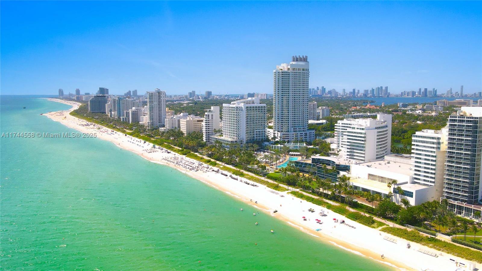 An aerial view shows a sandy beach along the oceanfront with several high-rise buildings — 4401 Collins Ave, Miami Beach FL 33140, MIAMI BEACH, FL