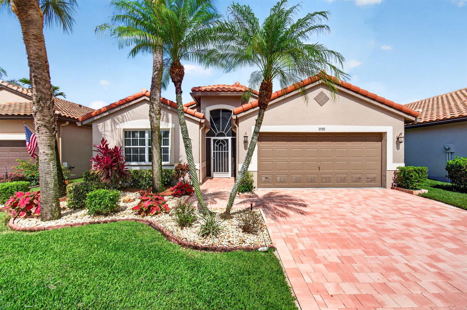 A single-story house with a tiled roof, a two-car garage, and palm trees in front — 11583 Ballylee Terrace, Boynton Beach FL 33437, BOYNTON BEACH, FL