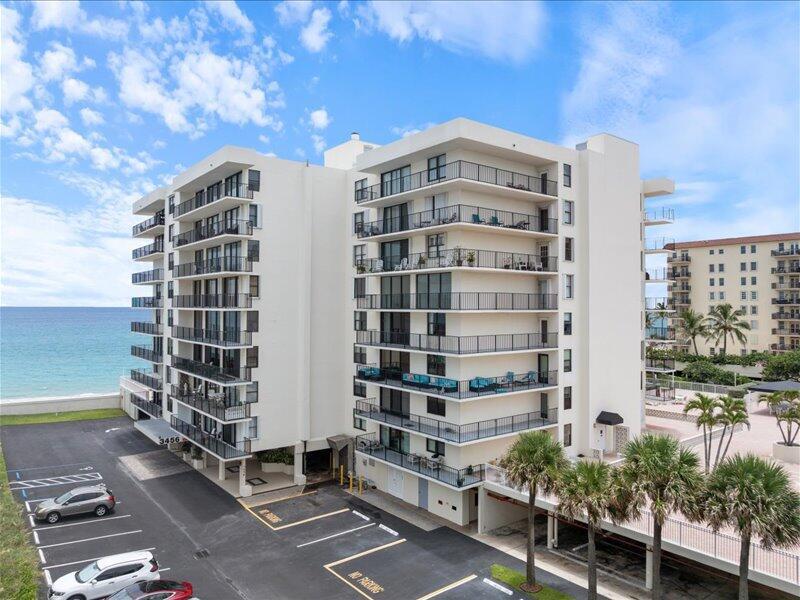 An exterior view of a multi-story residential building with balconies overlooking the ocean — 3456 S Ocean Boulevard # 505, Palm Beach FL 33480, PALM BEACH, FL