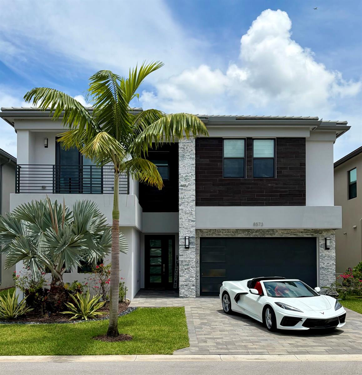A modern two-story house with a white exterior, stone accents, and a white sports car — 8573 Crystal Downs Avenue, Boca Raton FL 33434, BOCA RATON, FL