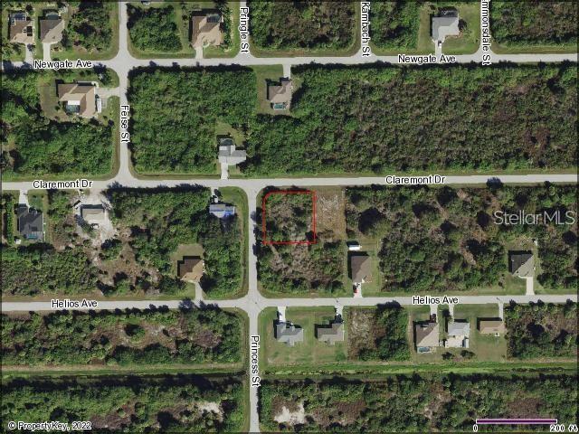 This is an aerial map showing a vacant residential lot outlined in red — 12087 CLAREMONT DRIVE, PORT CHARLOTTE, FL