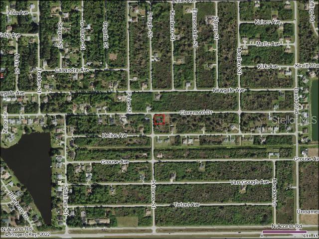 This is an aerial map showing a vacant lot outlined in red within a residential neighborhood — 12087 CLAREMONT DRIVE, PORT CHARLOTTE, FL