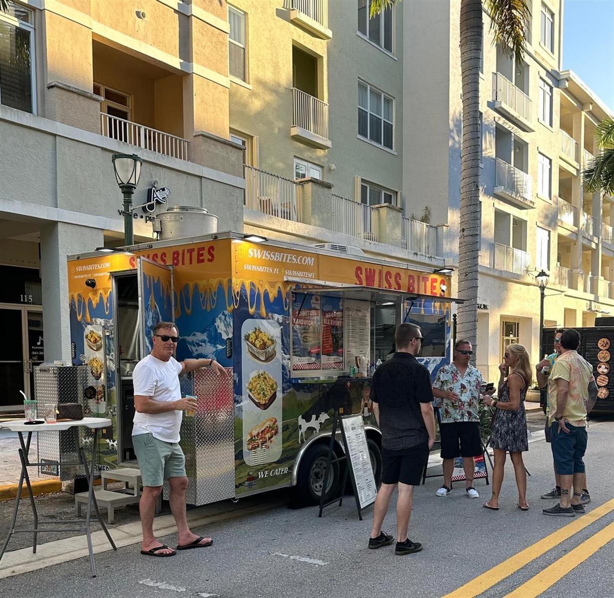 A Swiss Bites food truck is parked on a street in front of an apartment building — Hollywood Avenue, Hollywood FL 33020, HOLLYWOOD, FL