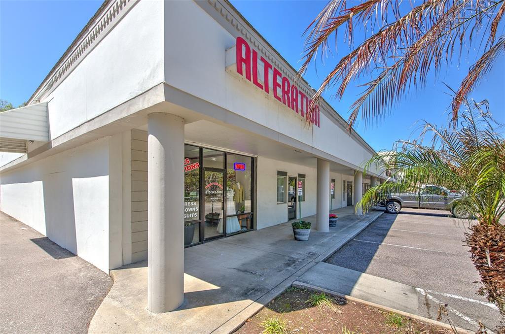 The exterior of a commercial building features a sign for alterations and a parking lot — 3662 LITHIA PINECREST ROAD, VALRICO, FL
