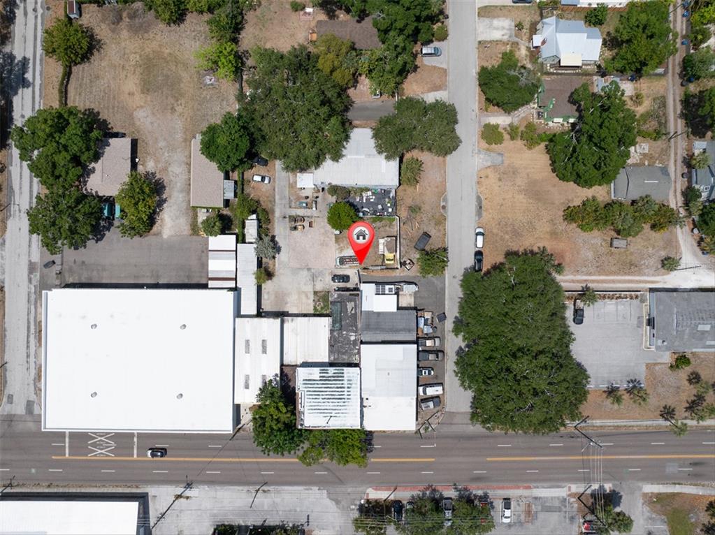 This aerial view shows a commercial property with multiple buildings and parking areas — 1763 9TH AVENUE N, ST PETERSBURG, FL