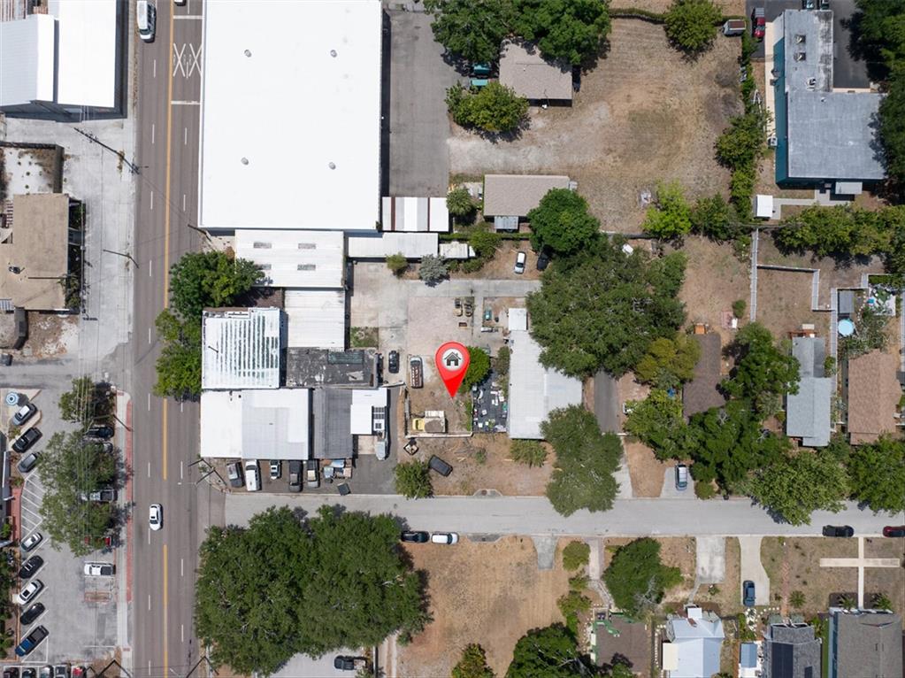 This is an aerial view of a property with a red location pin — 1763 9TH AVENUE N, ST PETERSBURG, FL