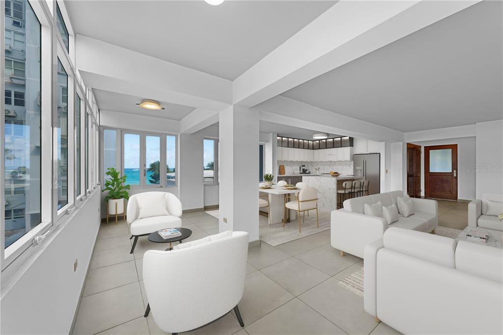 An open-concept living and dining area with white furniture, tile floors, and ocean views — 8 MANUEL RODRIGUEZ SERRA STREET UNIT 2B, SAN JUAN, PR