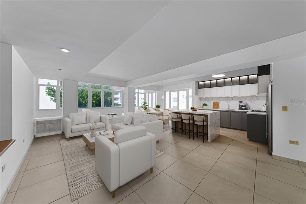 This is a virtually staged open-concept living room and kitchen with white cabinetry and tile floors — 8 MANUEL RODRIGUEZ SERRA STREET UNIT 2B, SAN JUAN, PR