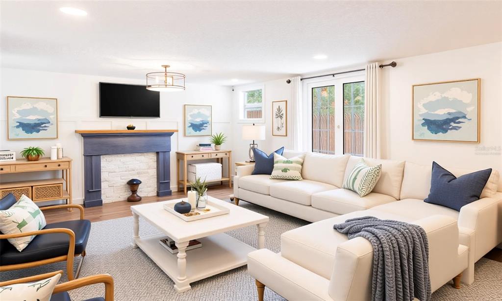 A living room features a blue fireplace, white sectional sofa, and a white coffee table — 206 W FRIERSON AVENUE, TAMPA, FL