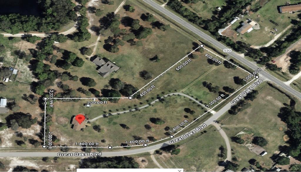 This is an aerial map of a large, grassy plot of land with property boundaries — 3440 BOGGY CREEK ROAD, KISSIMMEE, FL