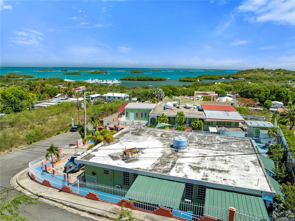 An aerial view shows a green building with a flat roof and surrounding coastal landscape — #3 CARR 304, LAJAS, PR