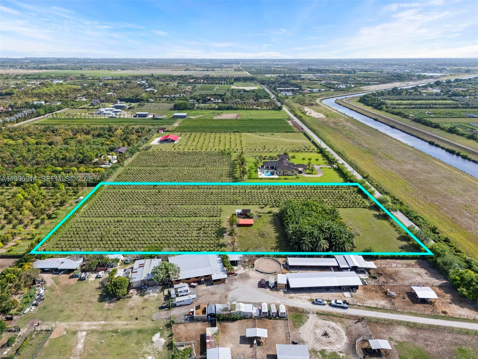 An aerial view shows a large rectangular plot of land with crops and outbuildings — 14651 SW 187 Ave, Miami FL 33196, MIAMI, FL