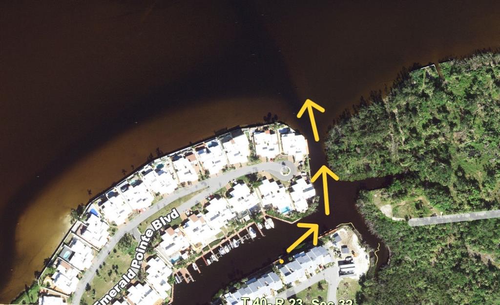 An aerial map view shows a residential waterfront community with a canal leading to open water — 25188 MARION AVENUE UNIT 1027, PUNTA GORDA, FL