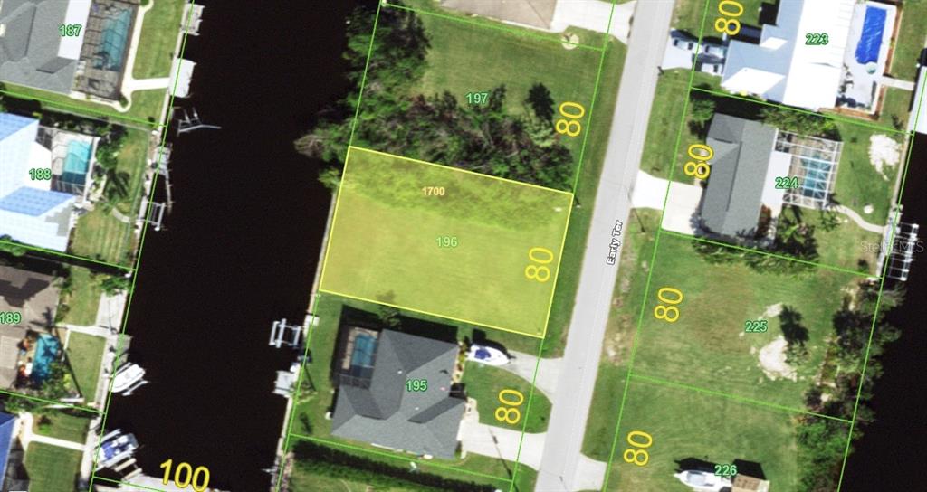 This is an aerial map showing a vacant residential lot highlighted in yellow — 5299 EARLY TERRACE, PORT CHARLOTTE, FL