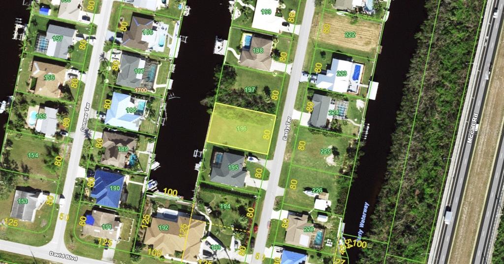 This is an aerial map showing residential lots and a canal in a neighborhood — 5299 EARLY TERRACE, PORT CHARLOTTE, FL