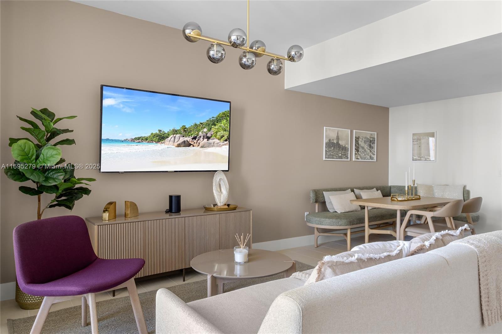 A living and dining area features a purple chair, a television, and a dining nook — 159 NE 6TH ST # 3209, Miami FL 33132, MIAMI, FL