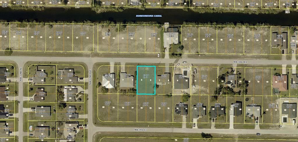 This is an aerial map showing a vacant residential lot highlighted in blue — 2056 NW 3RD TERRACE, CAPE CORAL, FL