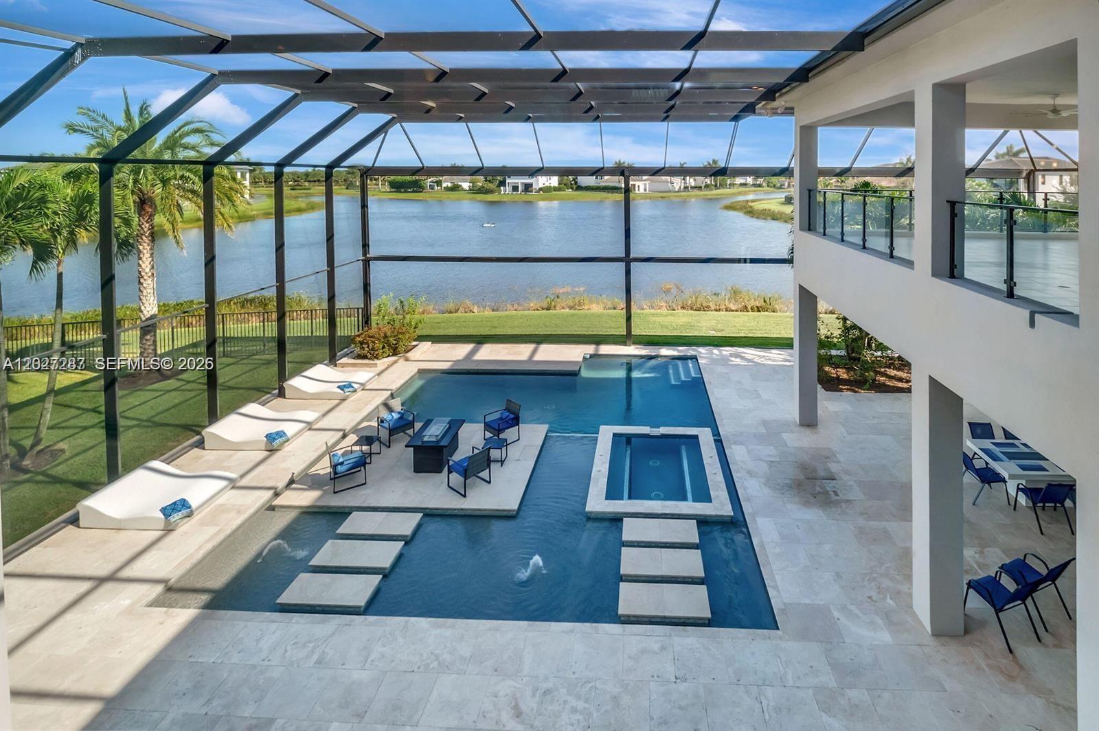 An outdoor pool area features a fire pit, a spa, and a screened-in patio enclosure — 17230 Brulee Breeze Way, Boca Raton FL 33496, BOCA RATON, FL