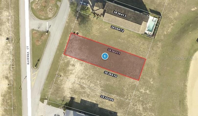 This is an aerial map showing a vacant residential lot highlighted in red — 16238 RAVENNA COURT, BELLA COLLINA, FL