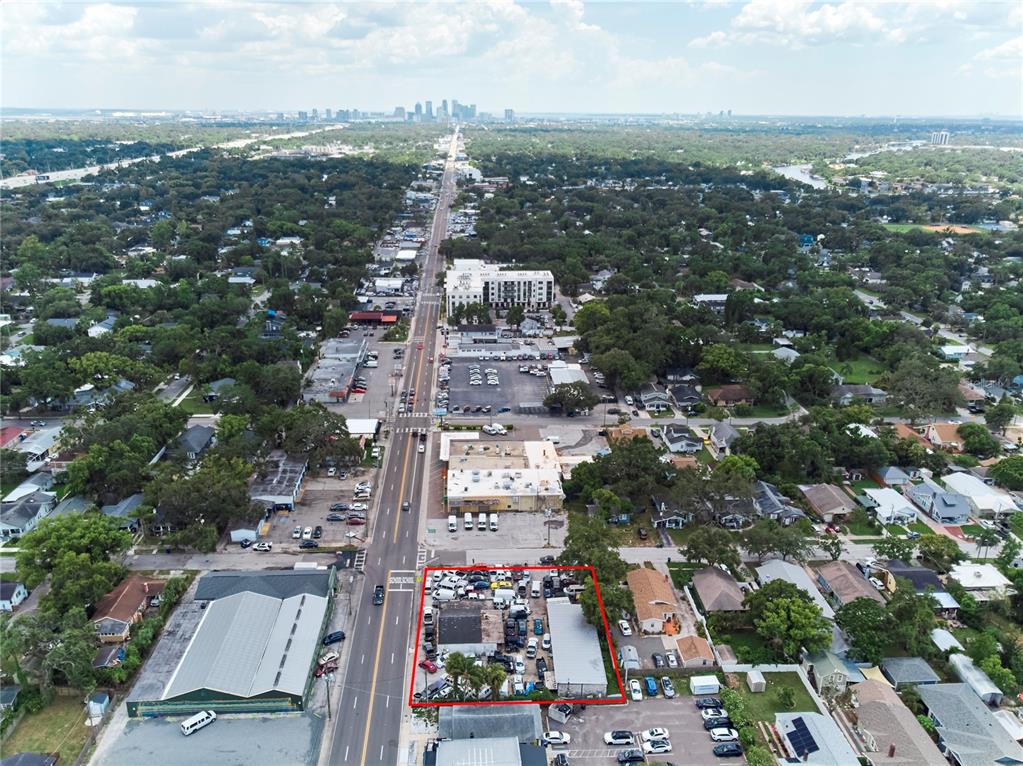 An aerial view shows a commercial property outlined in red along a busy road — 6304 N FLORIDA AVENUE, TAMPA, FL