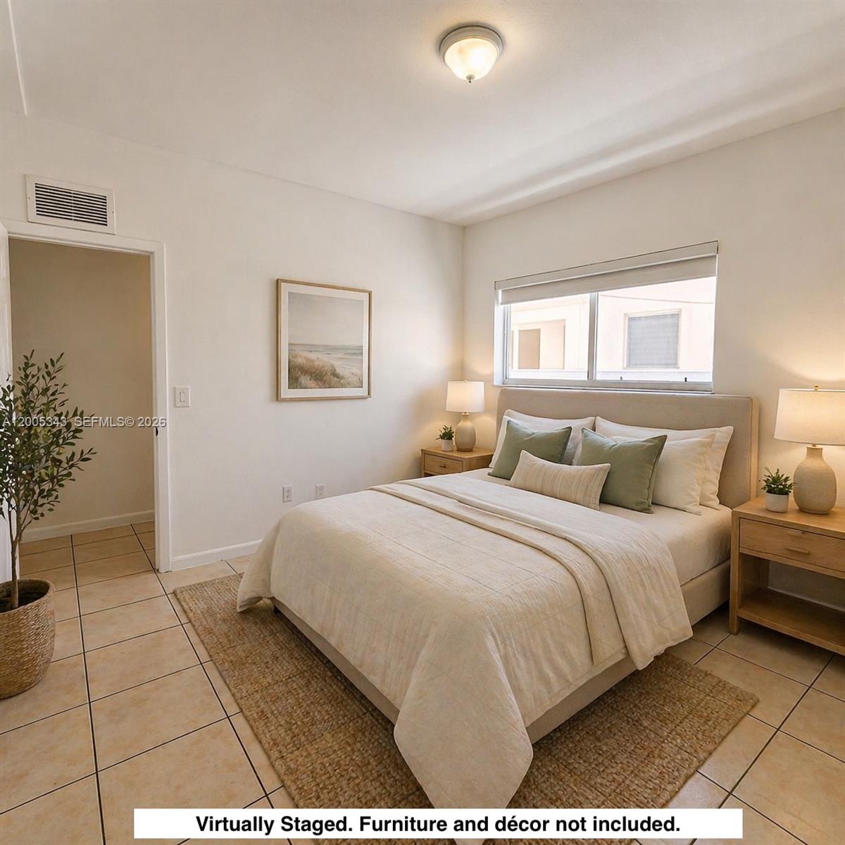This bedroom features a bed, two nightstands, tile flooring, and a window with blinds — 1185 Marseille Dr # 209, Miami Beach FL 33141, MIAMI BEACH, FL