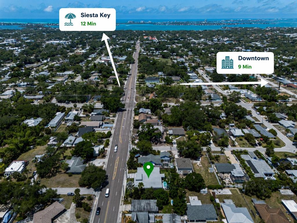 This aerial view shows a residential property marked with a pin near a main road — 2441 WEBBER STREET, SARASOTA, FL