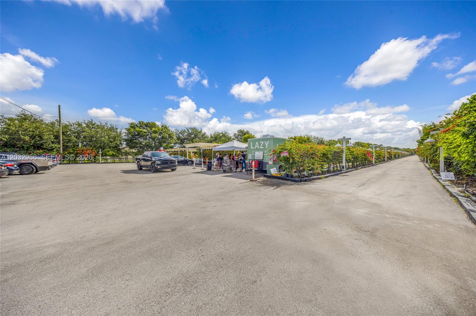 A paved parking lot features a food truck, a white canopy, and lush landscaping — 4680 SW 148th Ave, Southwest Ranches FL 33330, SOUTHWEST RANCHES, FL