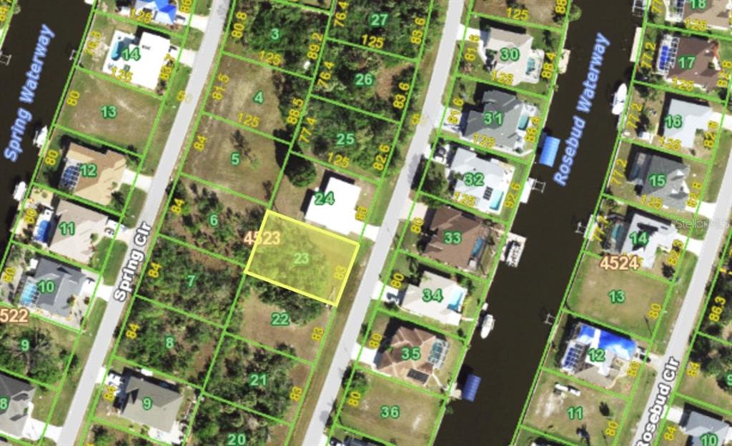 This is a map showing a vacant residential lot highlighted in yellow — 9413 SPRING CIRCLE, PORT CHARLOTTE, FL