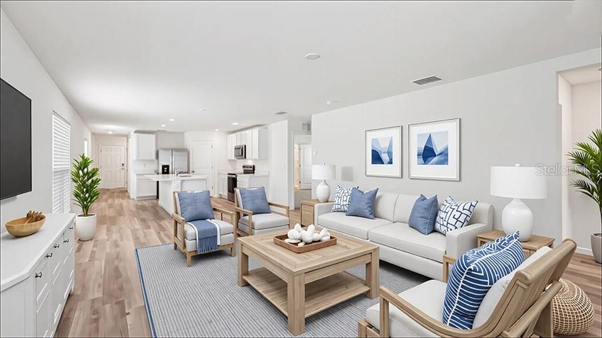 This is a rendering of an open-concept living room with a kitchen and light wood flooring — 24381 NW 10TH ROAD, NEWBERRY, FL