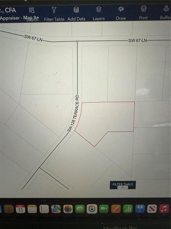 This is a digital map showing a property parcel outlined in red along a road — TBD SW 128TH TERRACE, OCALA, FL