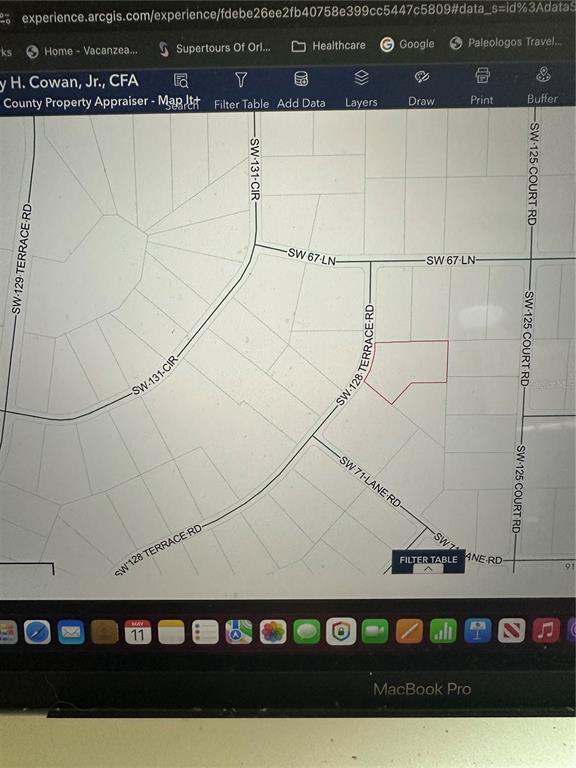 This is a digital map showing a highlighted property parcel located near SW 128 Terrace Road — TBD SW 128TH TERRACE, OCALA, FL