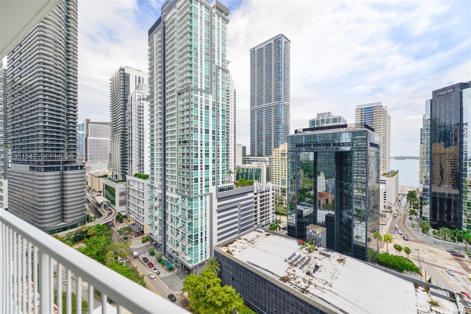 An elevated view of a dense urban skyline featuring multiple modern glass skyscrapers and streets — 1250 S Miami Ave # 1906, Miami FL 33130, MIAMI, FL