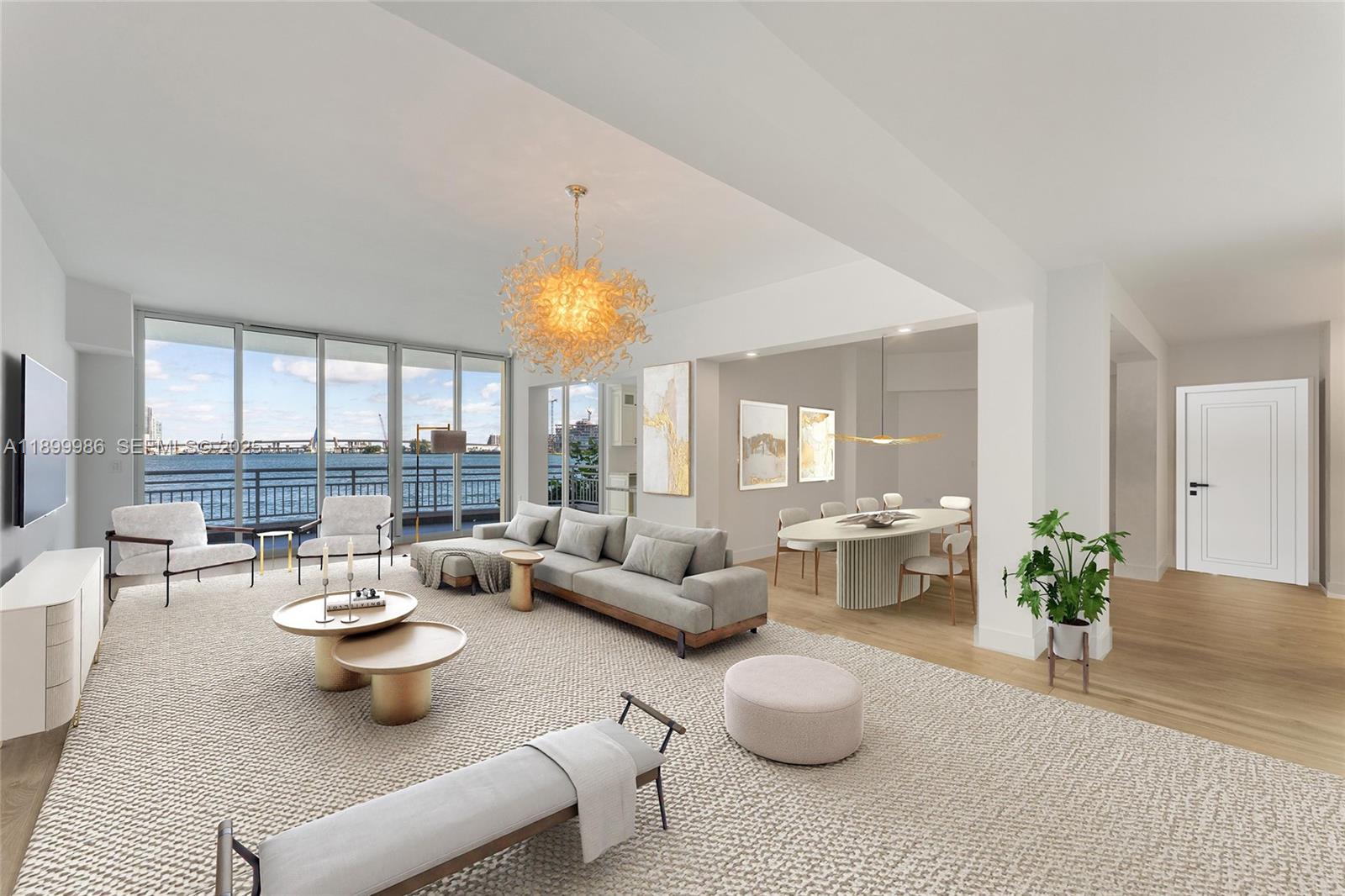 A bright, open-concept living and dining area features floor-to-ceiling windows with a waterfront view — 848 Brickell Key Dr # 204, Miami FL 33131, MIAMI, FL