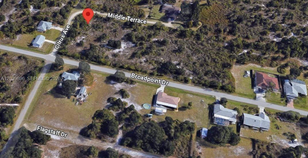 This aerial map view shows a vacant corner lot at the intersection of two roads — 2075 NE MIDDLE TER, Punta Gorda FL 33983, PUNTA GORDA, FL