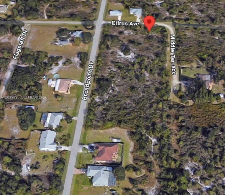 This is an aerial map view of a vacant lot located at a street intersection — 2075 NE MIDDLE TER, Punta Gorda FL 33983, PUNTA GORDA, FL