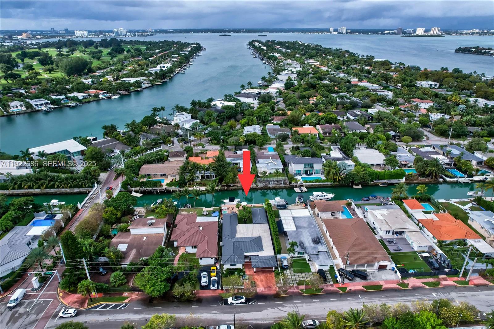 An aerial view shows a waterfront house with a pool and boat dock — 7724 Hawthorne Ave, Miami Beach FL 33141, MIAMI BEACH, FL