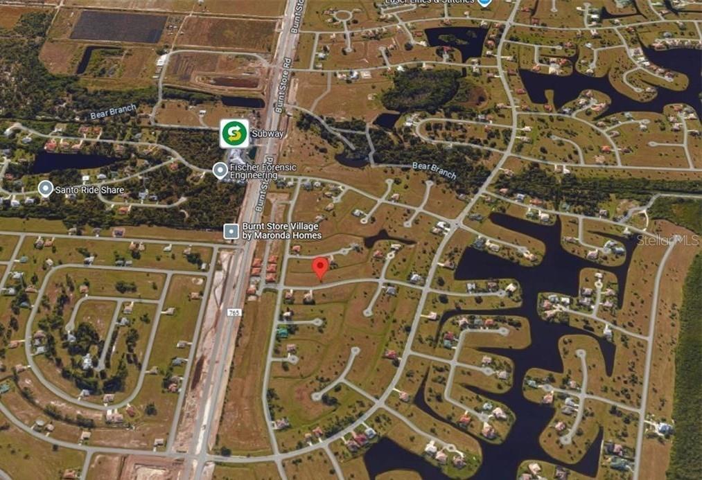 This is an aerial map view of a residential neighborhood near Burnt Store Road — 24465 SAN RAFAEL ROAD, PUNTA GORDA, FL