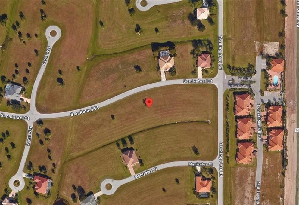 This is an aerial map view of a vacant residential lot in a suburban neighborhood — 24465 SAN RAFAEL ROAD, PUNTA GORDA, FL