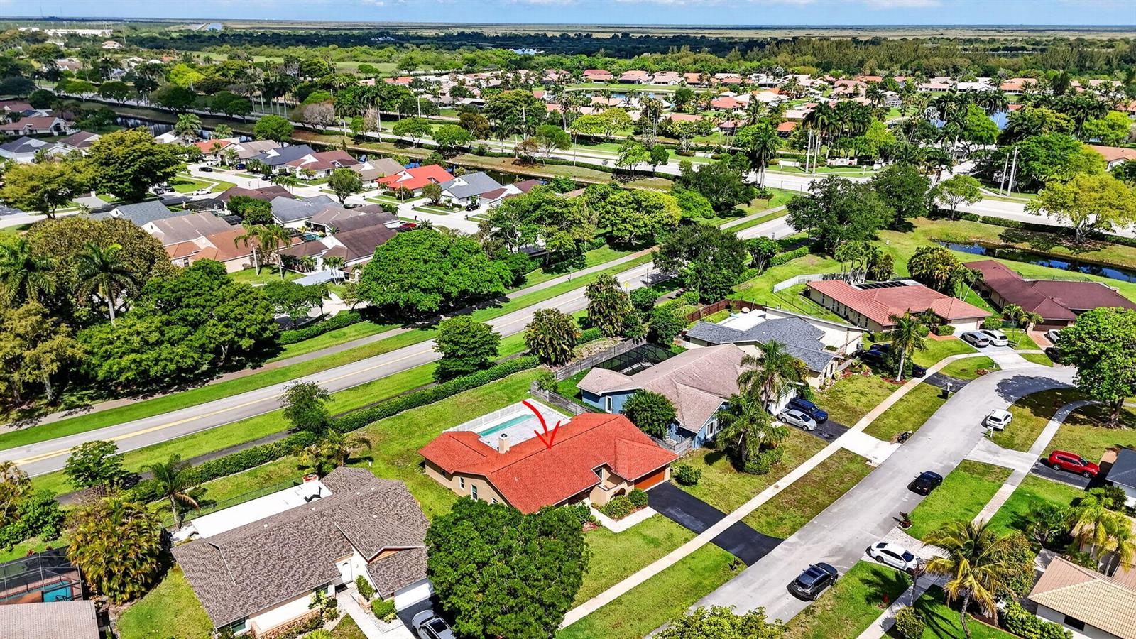 An aerial view of a suburban neighborhood featuring a house with a red roof — 20876 Sugarloaf Lane, Boca Raton FL 33428, BOCA RATON, FL