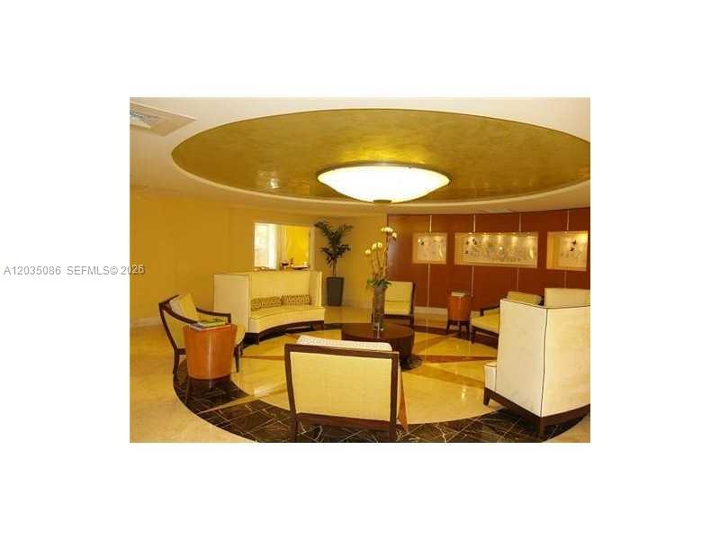 A circular lobby features a gold-leaf ceiling, a central light fixture, and arranged seating furniture — 7350 SW 89th St # 505S, Miami FL 33156, MIAMI, FL