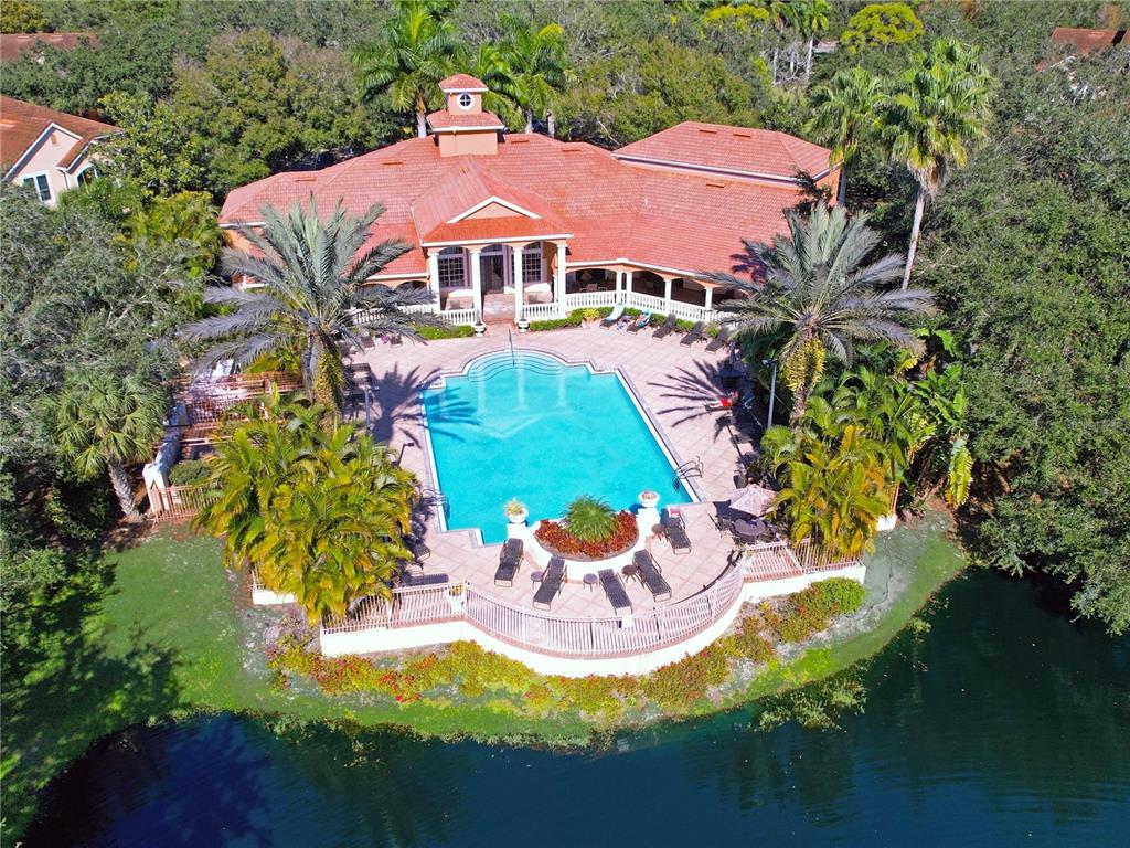 An aerial view of a large house with a red tile roof and swimming pool — 4134 CENTRAL SARASOTA PKWY UNIT 1722, SARASOTA, FL