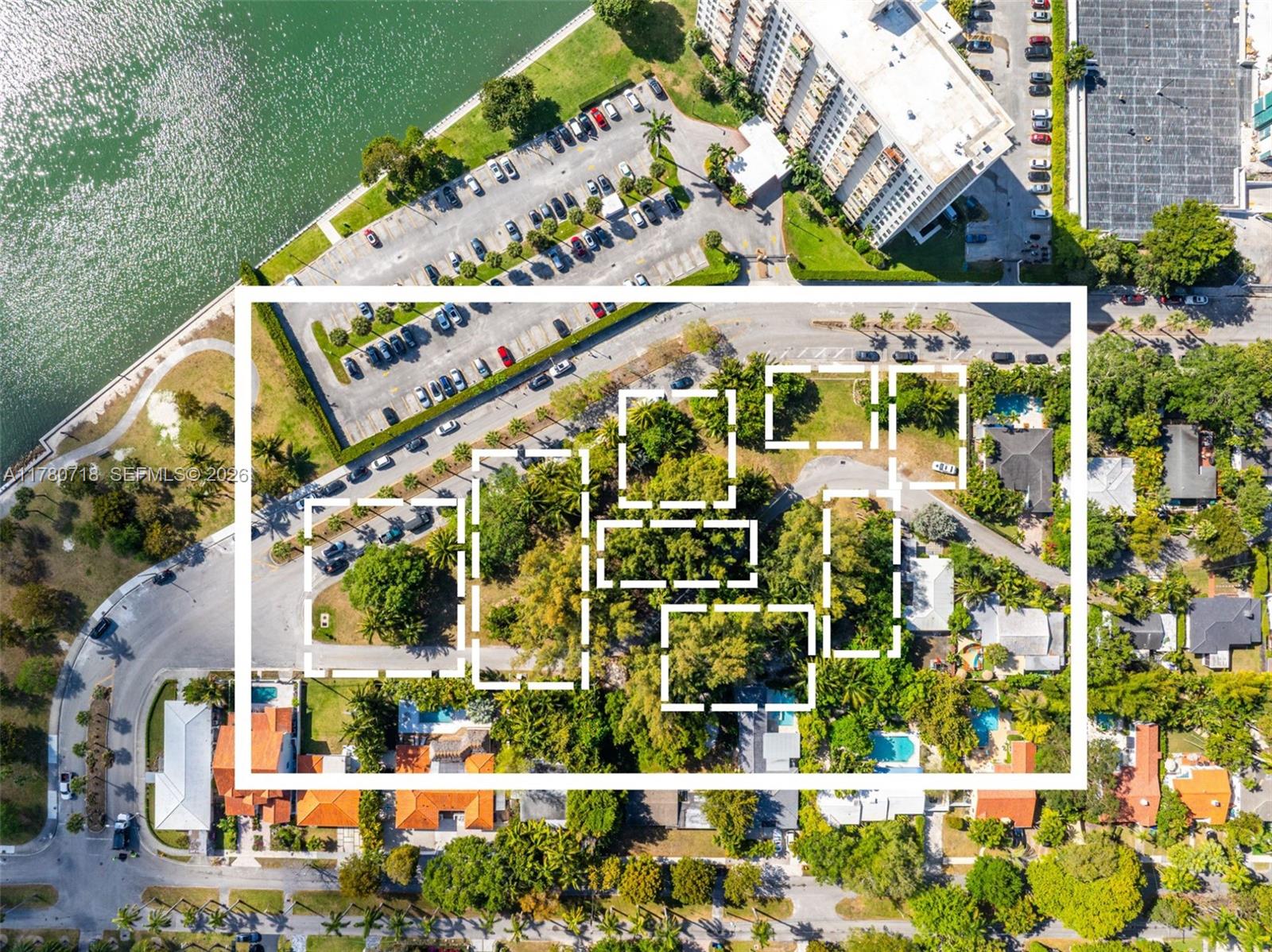 This aerial view shows a residential area with highlighted land parcels and nearby parking lots — 890 NE 70th St, Miami FL 33138, MIAMI, FL