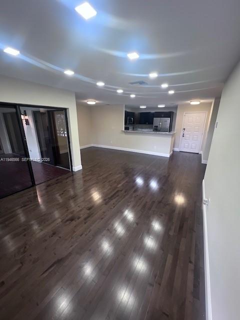 An open-concept living area features dark hardwood floors, recessed lighting, and a kitchen pass-through — 20005 NE 3rd Ct # 6, Miami FL 33179, MIAMI, FL