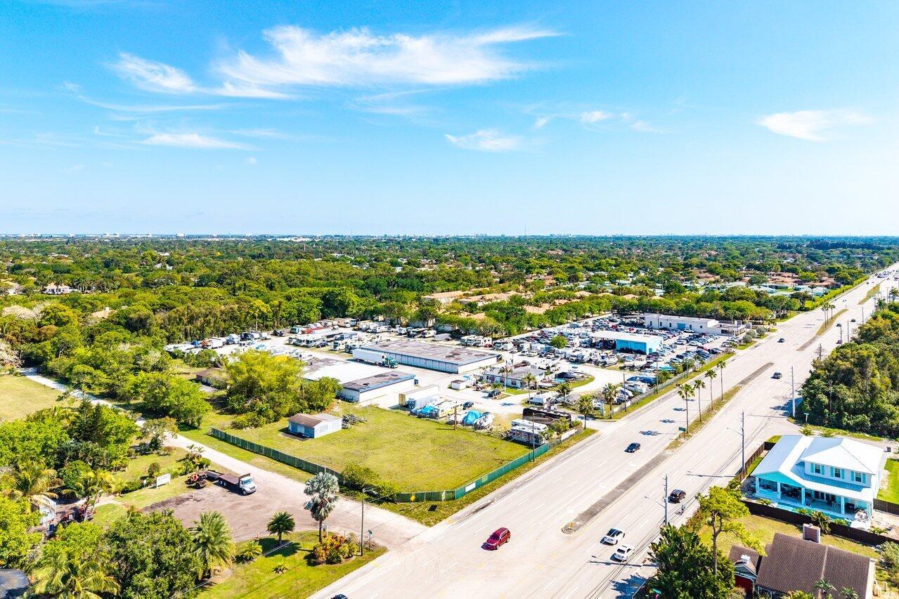 An aerial view shows a commercial property with a large parking lot and warehouse buildings — 0 S Military Trail, Delray Beach FL 33415, DELRAY BEACH, FL